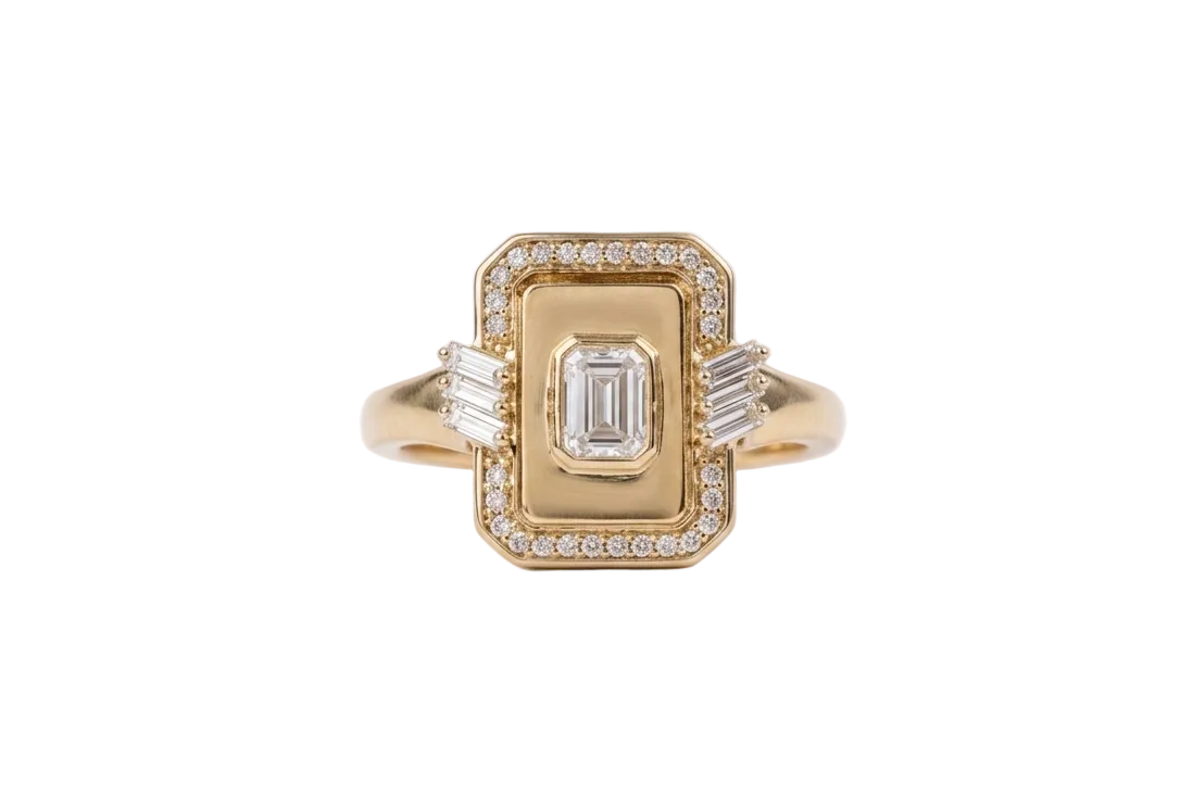 Gold ring with emerald-cut center stone and diamond accents on a white background